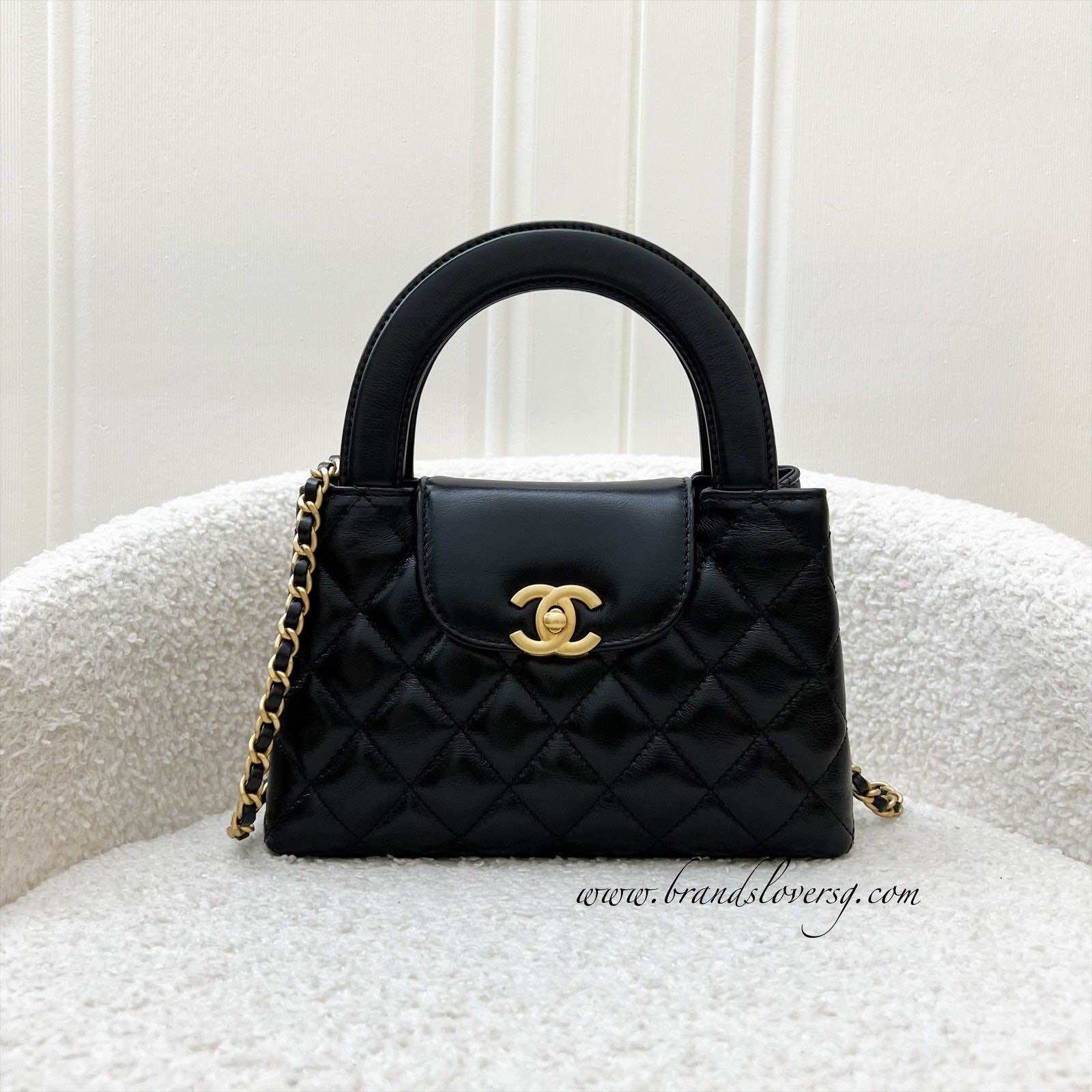 Borsa Chanel Mini/Piccola Kelly in pelle di vitello invecchiata nera lucida e AGHW