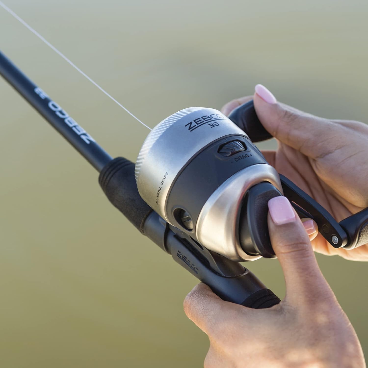 Zebco 33 Spincast Reel and 2-Piece Fishing Rod Combo, 5-Foot 6-Inch Durable Fiberglass Rod, Quickset Anti-Reverse Fishing Reel with Bite Alert · v2