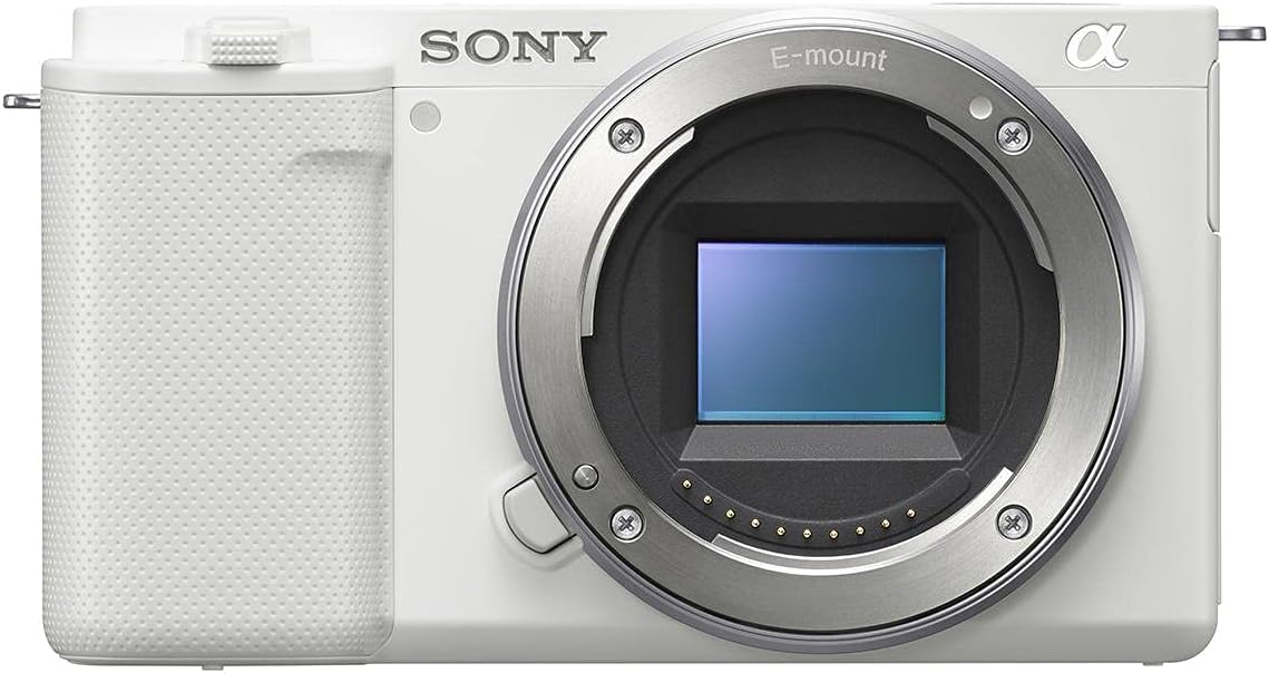 Sony ZV-E10 APS-C Mirrorless Interchangeable Lens Vlogging Camera, White - Bundle ACCVC1 Vlogger Accessory Kit (Shooting Grip  64GB UHS-II SDXC Card)